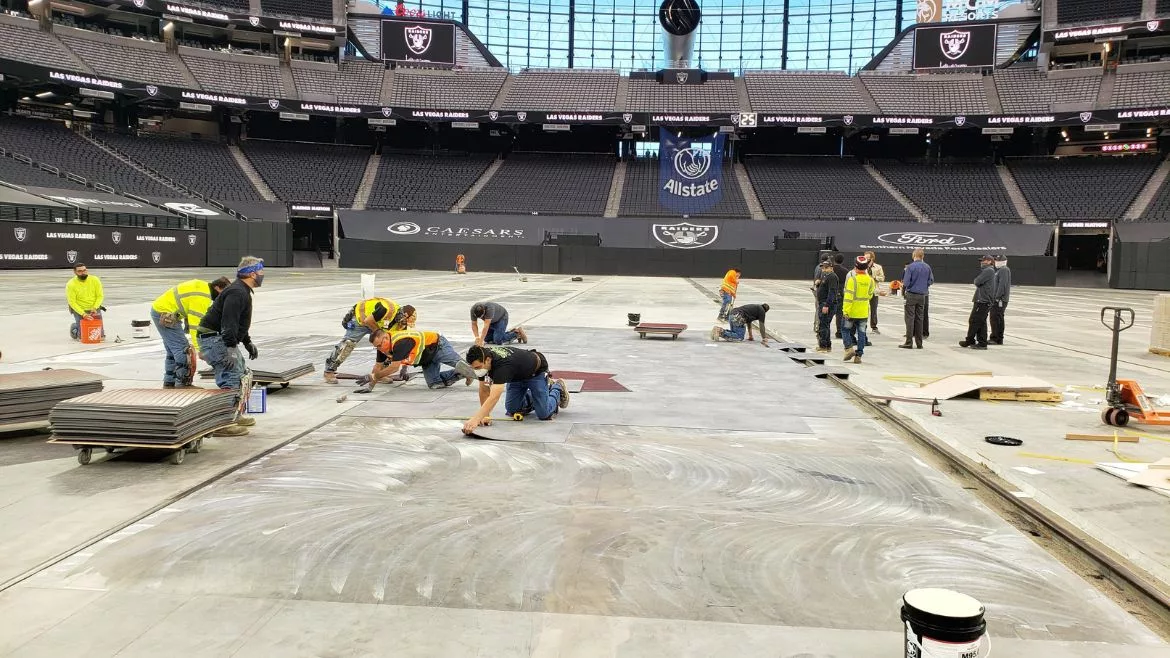 installation of flooring at Raiders Stadium