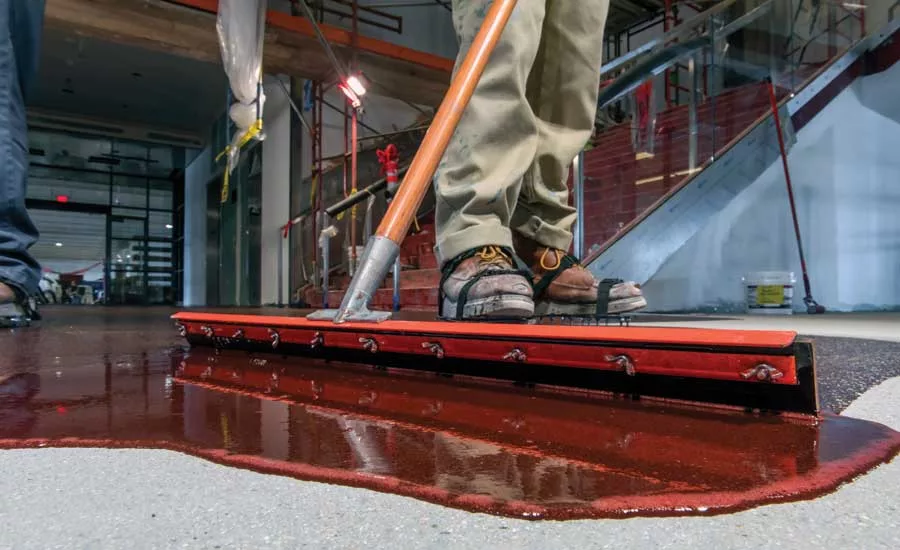 spreading material with squeegee