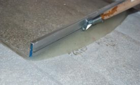 applying moisture barrier over concrete
