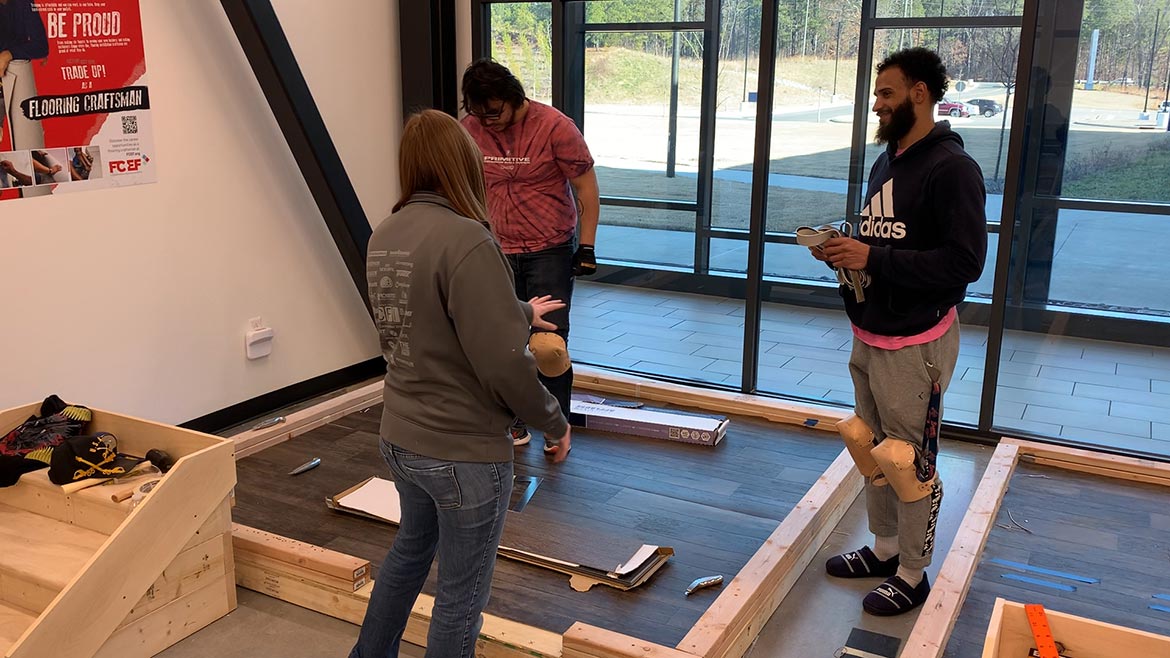 Zurn coaching John Knowles and Andrew Slaton during the first semester of the FCEF Basic Floor Covering Installation Program