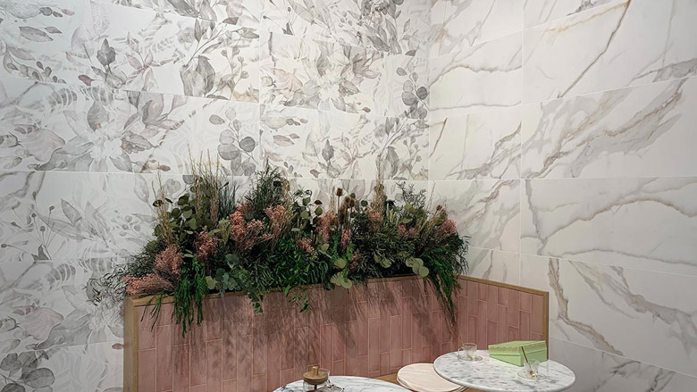 nature-inspired pattern with leaves and flowers visible on top of white marble