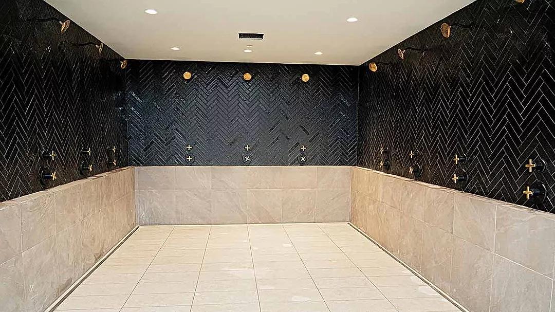 continuous trench-drain system around open shower layout