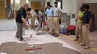 Daniel Grant demonstrates self-leveling underlayment application