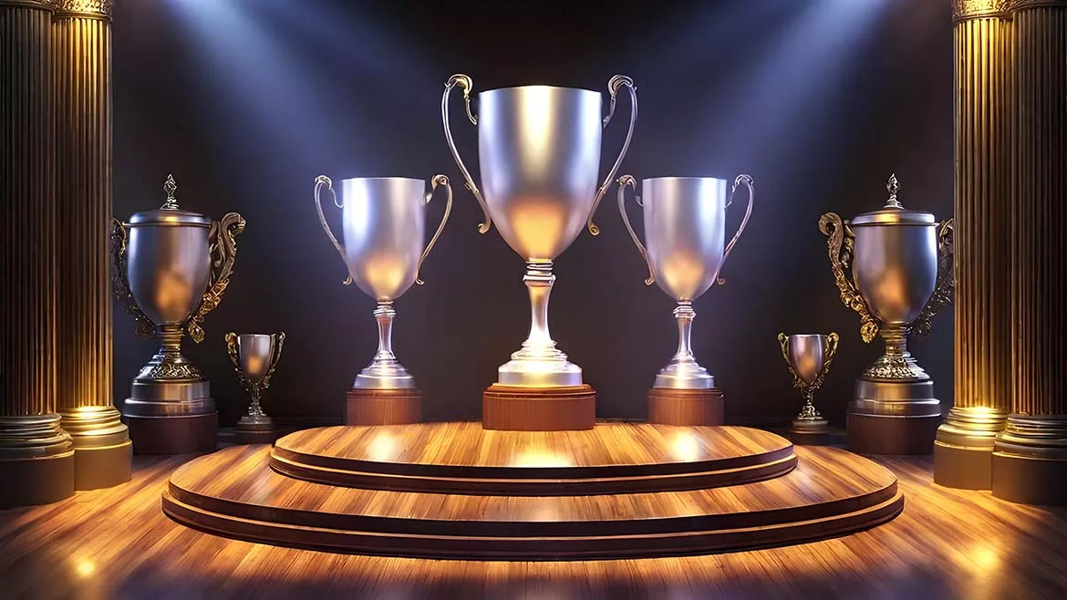 five silver trophies on a stage