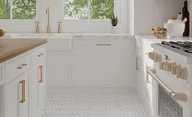 kitchen with white cabinets and gold hardware