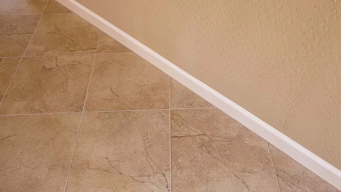 tile floor abutting a wall