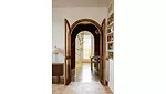 wooden arches separating the entrance hall from the living room