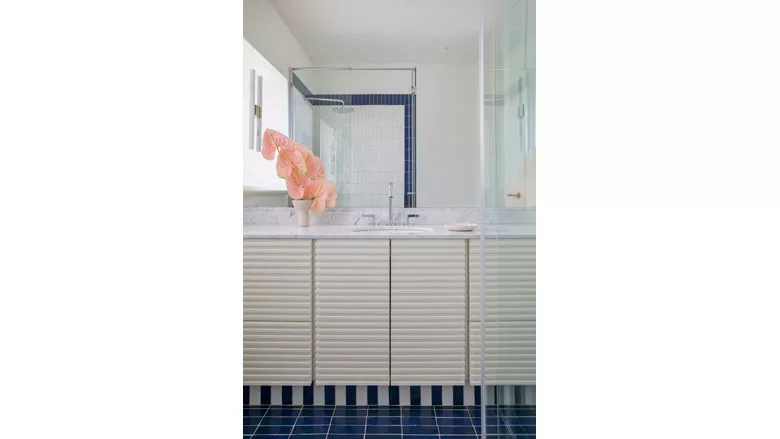 blue and white tile installed in bathroom