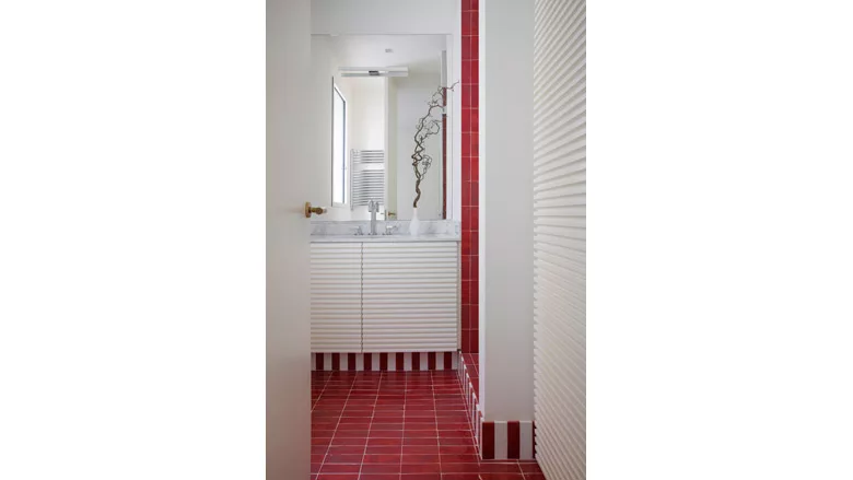 red and white tile installed in bathroom