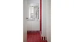 red and white tile installed in bathroom