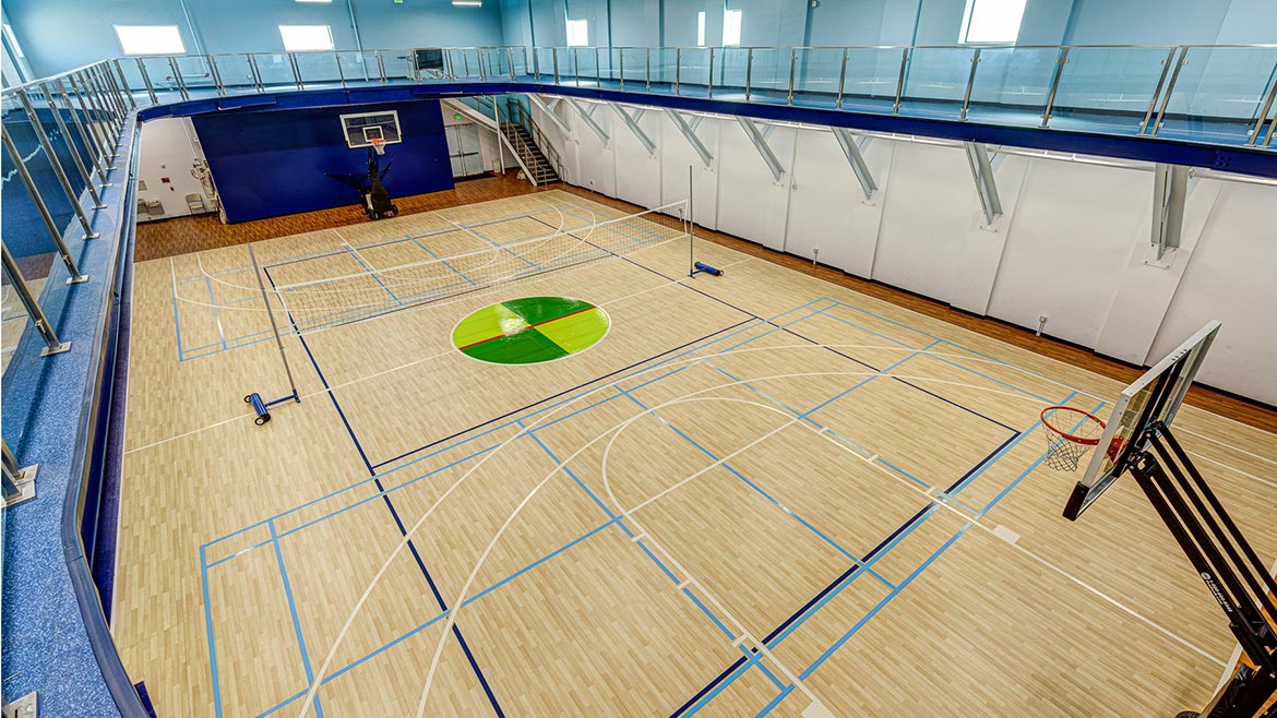 Ecore’s Bounce 2 Motivate Class I wood-look flooring used in basketball court