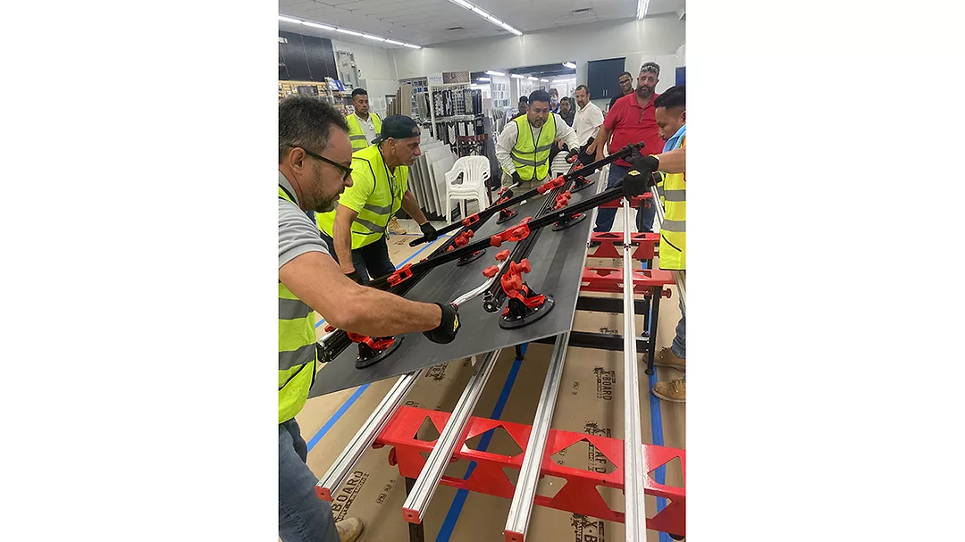 moving GPTP panels onto a table for fabrication