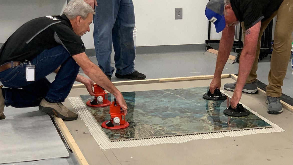 Step 10: maneuver the porcelain tile slab and place