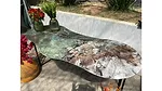 Capital Granites & Marbles Green and earth tones as table