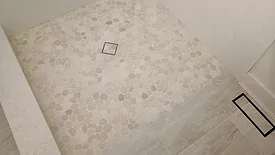 A 3’x4’ semi-curbless shower in a client's guest bath